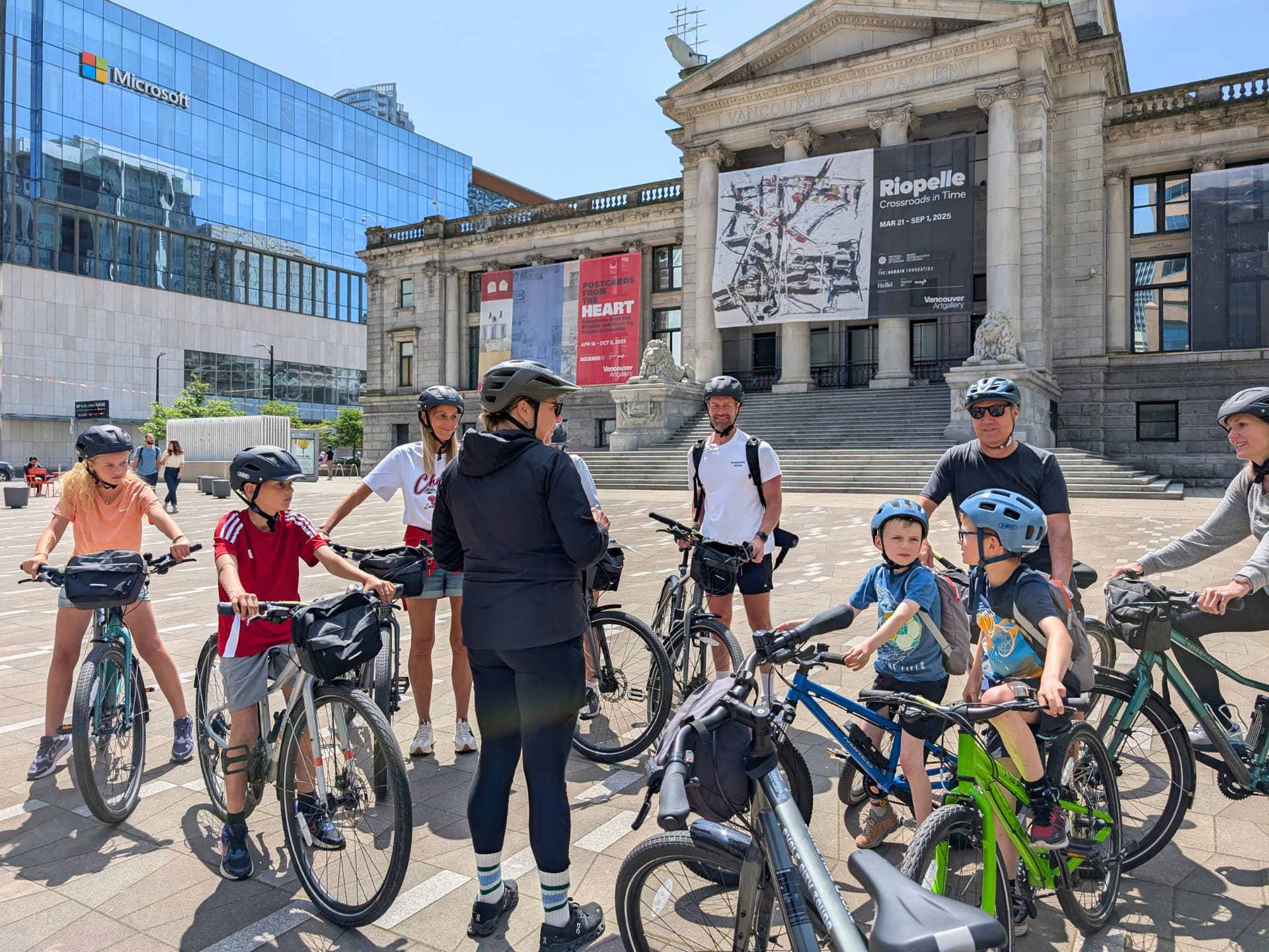 the group stands in front of the Vancouver Art Gallery in preparation for their Stanley Park bike tour